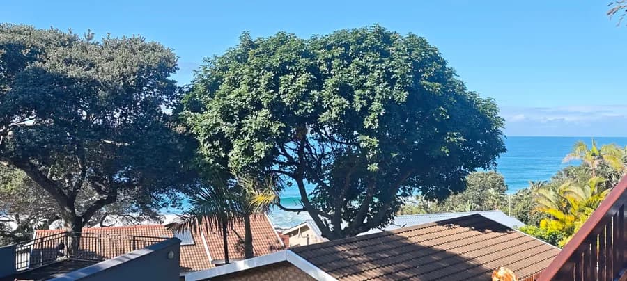 Sea view over the GreenHart Estate rooftops