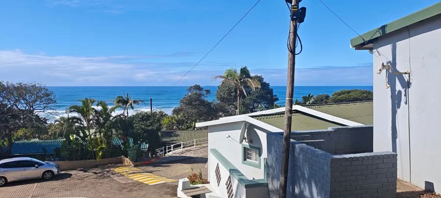View across the estate rooftops to the sea