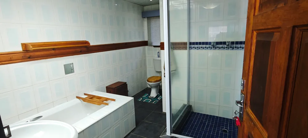 Bathroom with a bath and a separate shower
