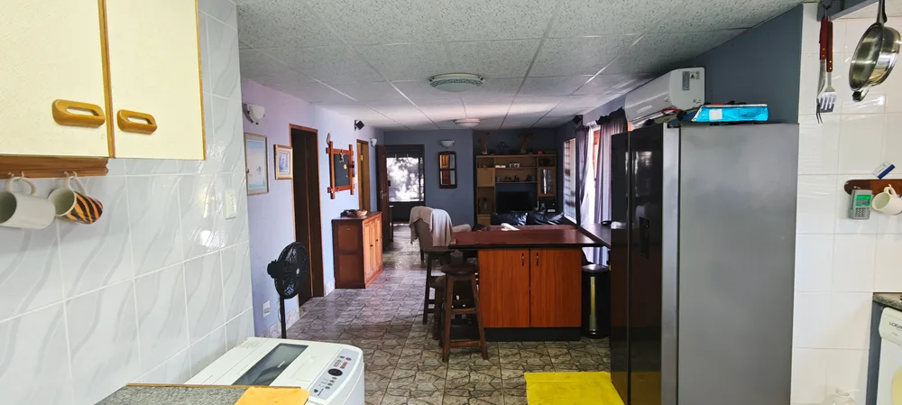 Kitchen looking through to the dining area and breakfast counter