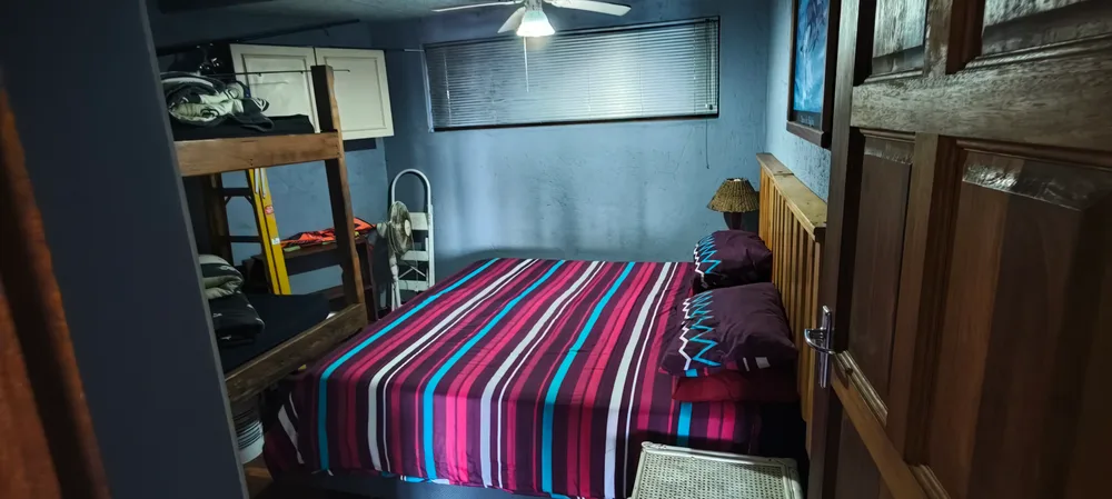 Bedroom with a double bed and bunk beds