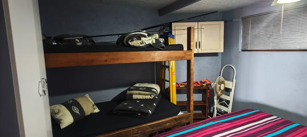 Bunk beds with storage cupboards above